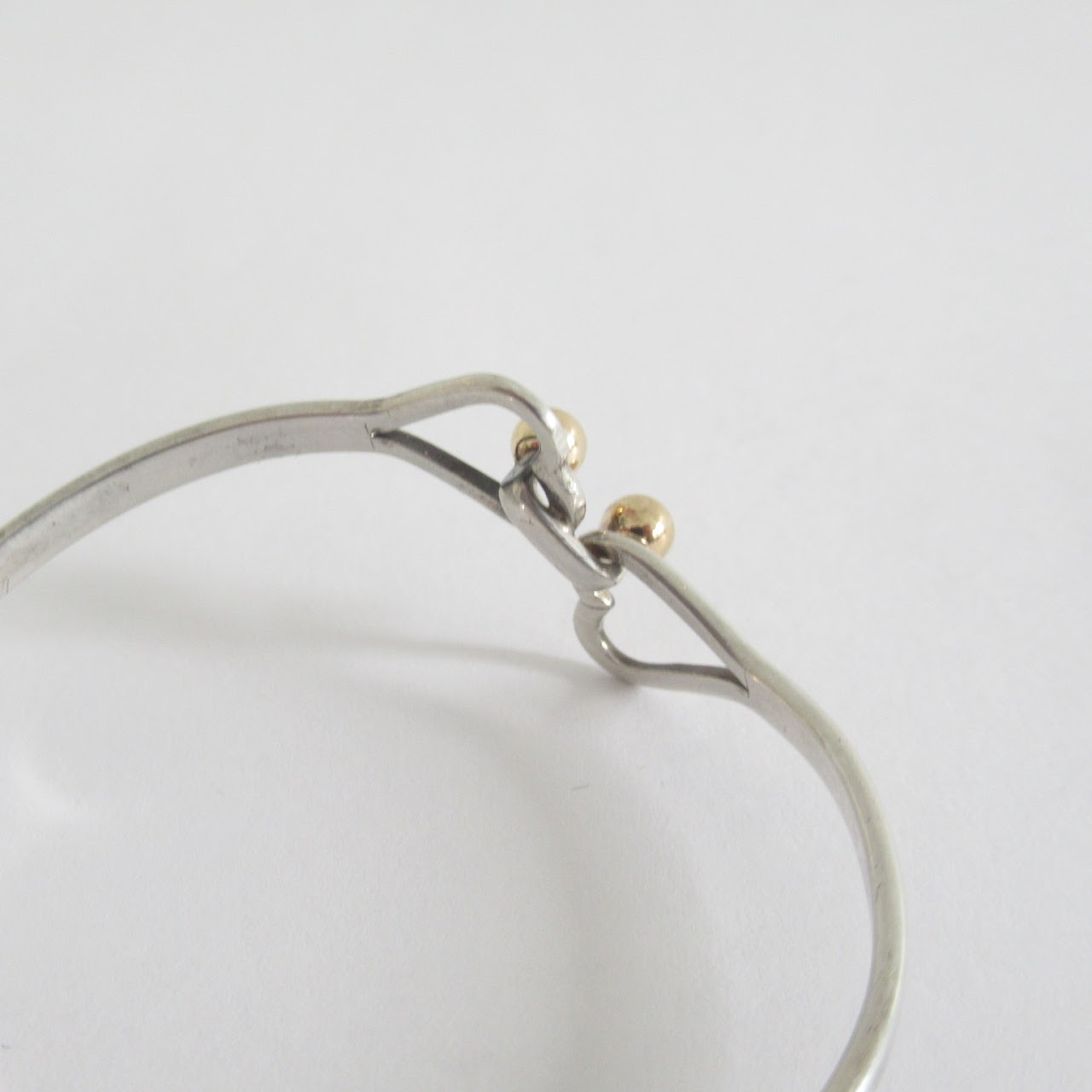 Tiffany & Co. Sterling Silver & 18K Gold Interlocking Hearts Bangle