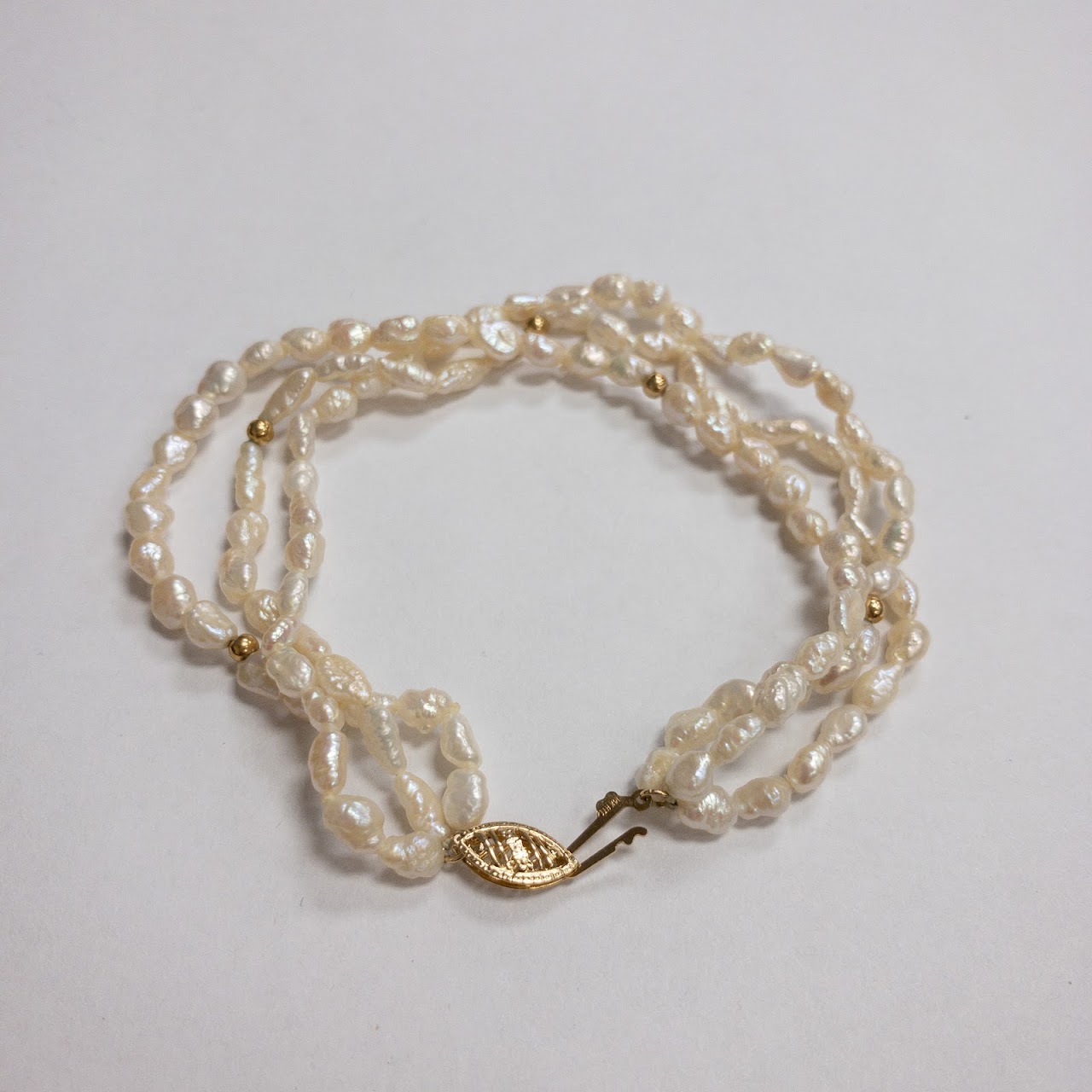 Pearl and 14K Gold Triple Strand Bracelet