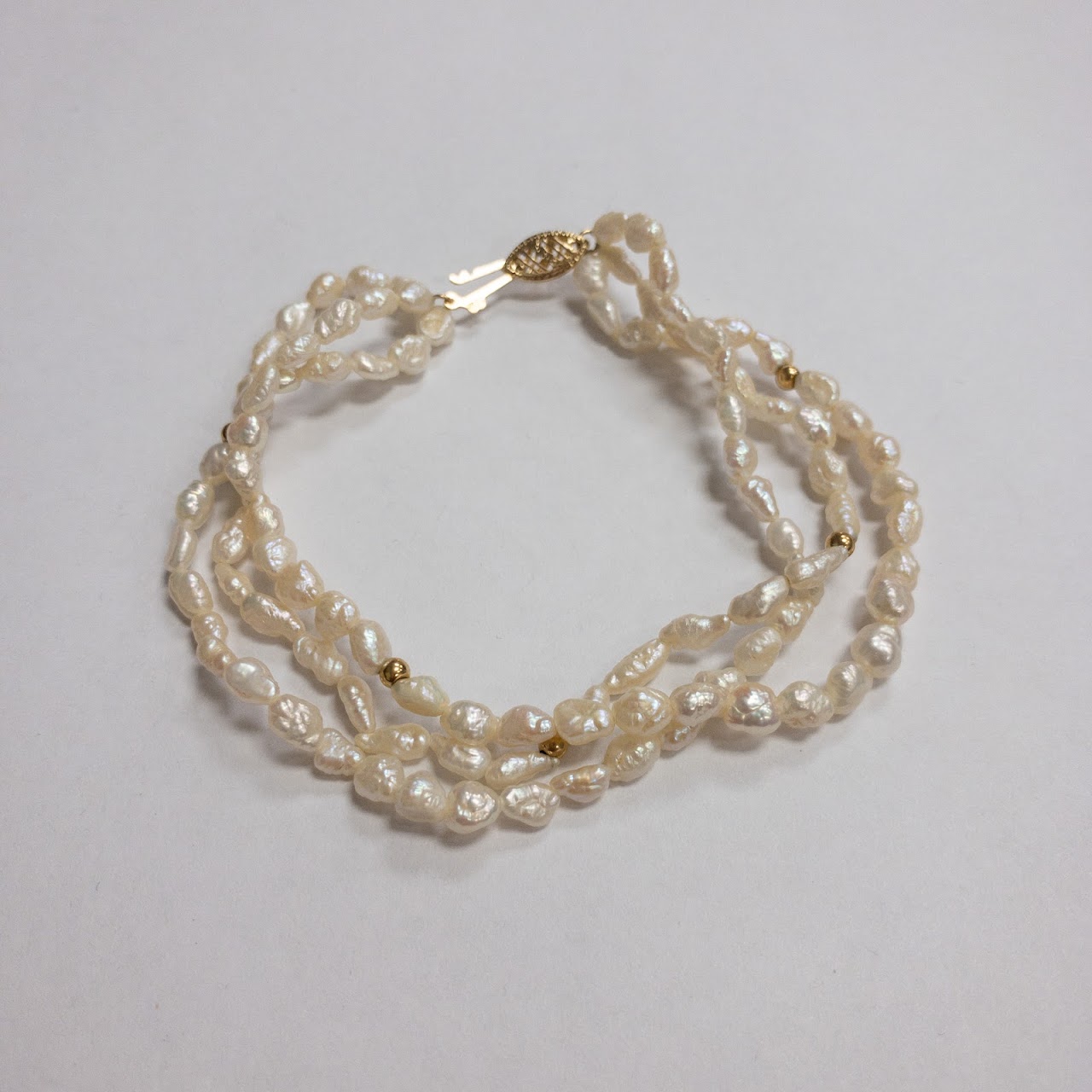 Pearl and 14K Gold Triple Strand Bracelet