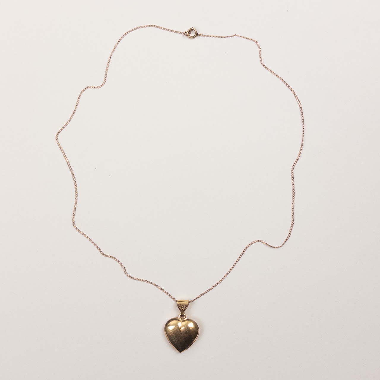 14K Gold Heart Pendant on a Curb Chain Necklace