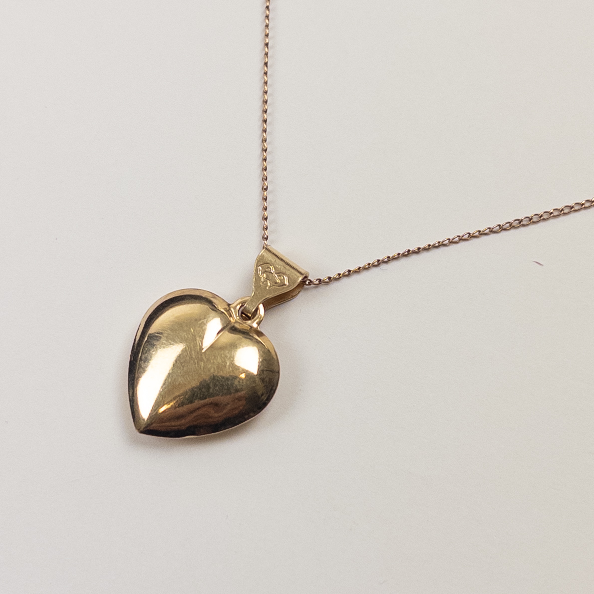 14K Gold Heart Pendant on a Curb Chain Necklace
