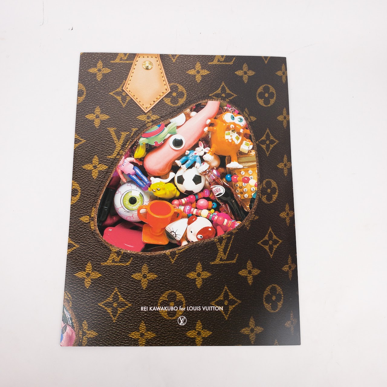 A SET OF TWO: LIMITED EDITION CELEBRATING MONOGRAM ICONOCLAST PUNCHING BAG  PM & CELEBRATING ICON & ICONOCLAST 160 YEARS MONOGRAM BOOK, LOUIS VUITTON,  2014
