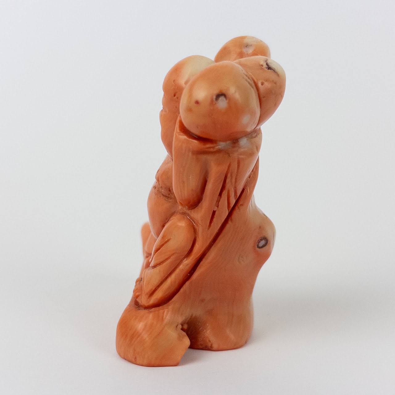 Coral Laughing Buddha Statuette