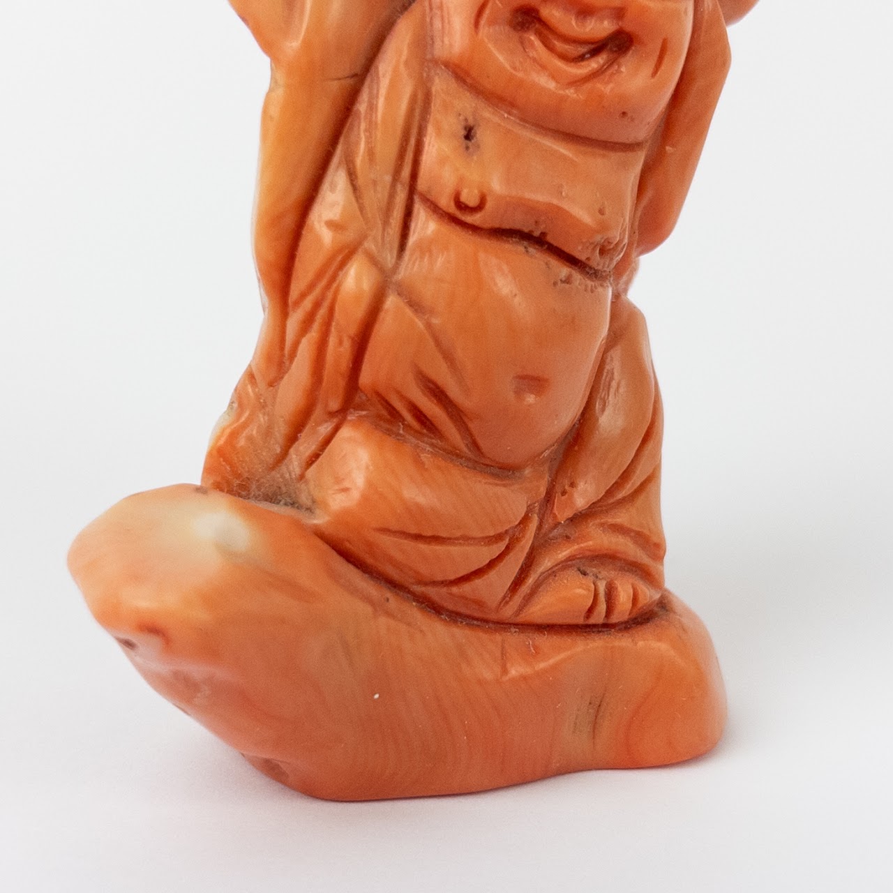 Coral Laughing Buddha Statuette