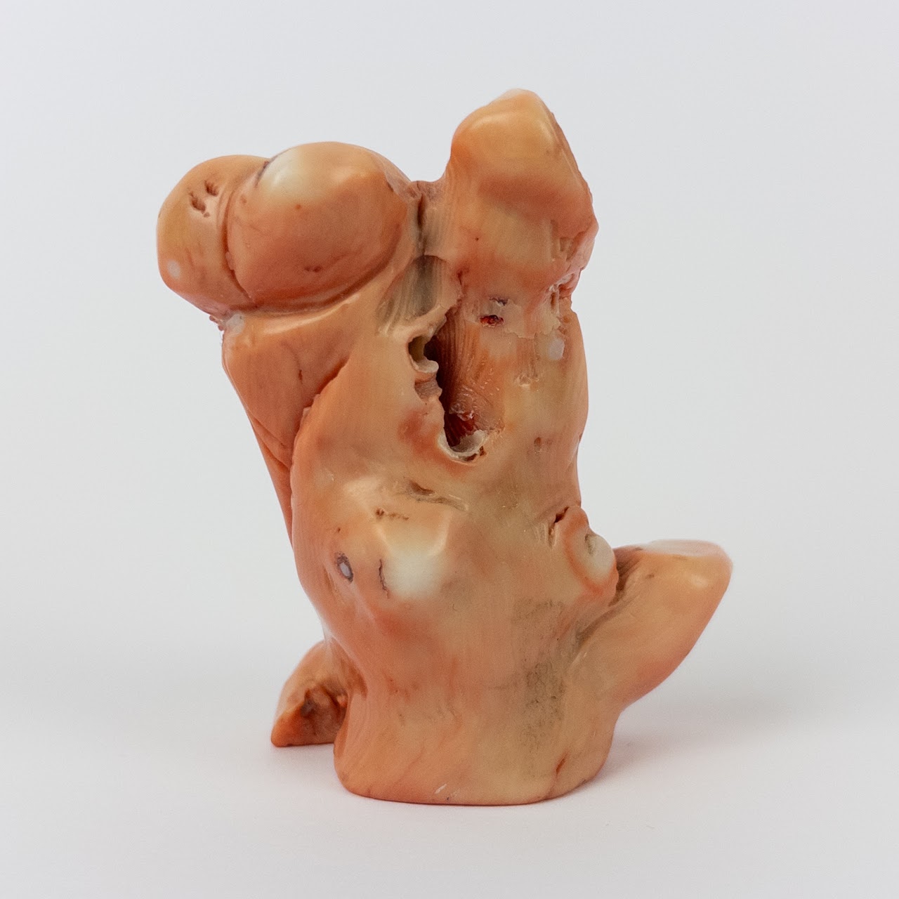 Coral Laughing Buddha Statuette