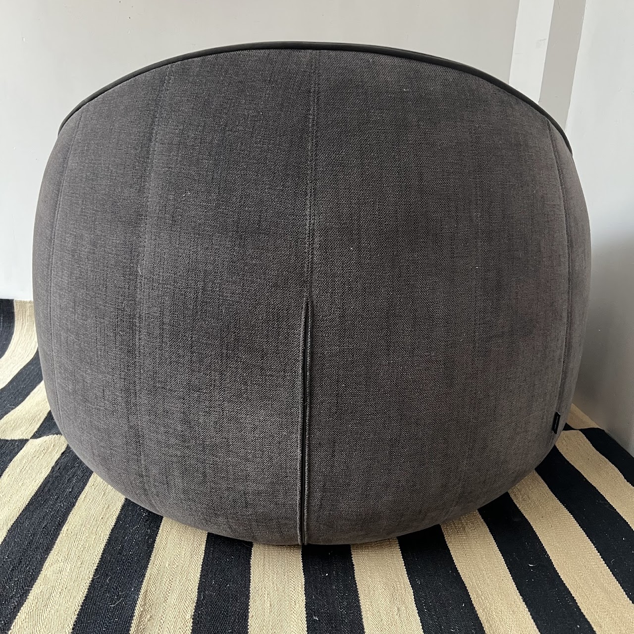 Ligne Roset Channel Tufted Ottoman Swivel Chair and Ottoman