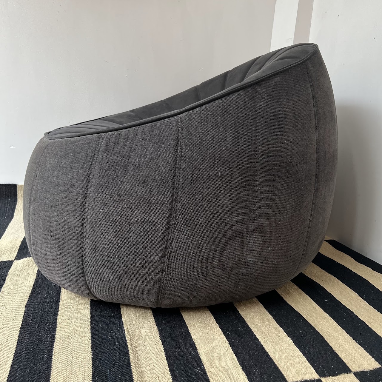 Ligne Roset Channel Tufted Ottoman Swivel Chair and Ottoman