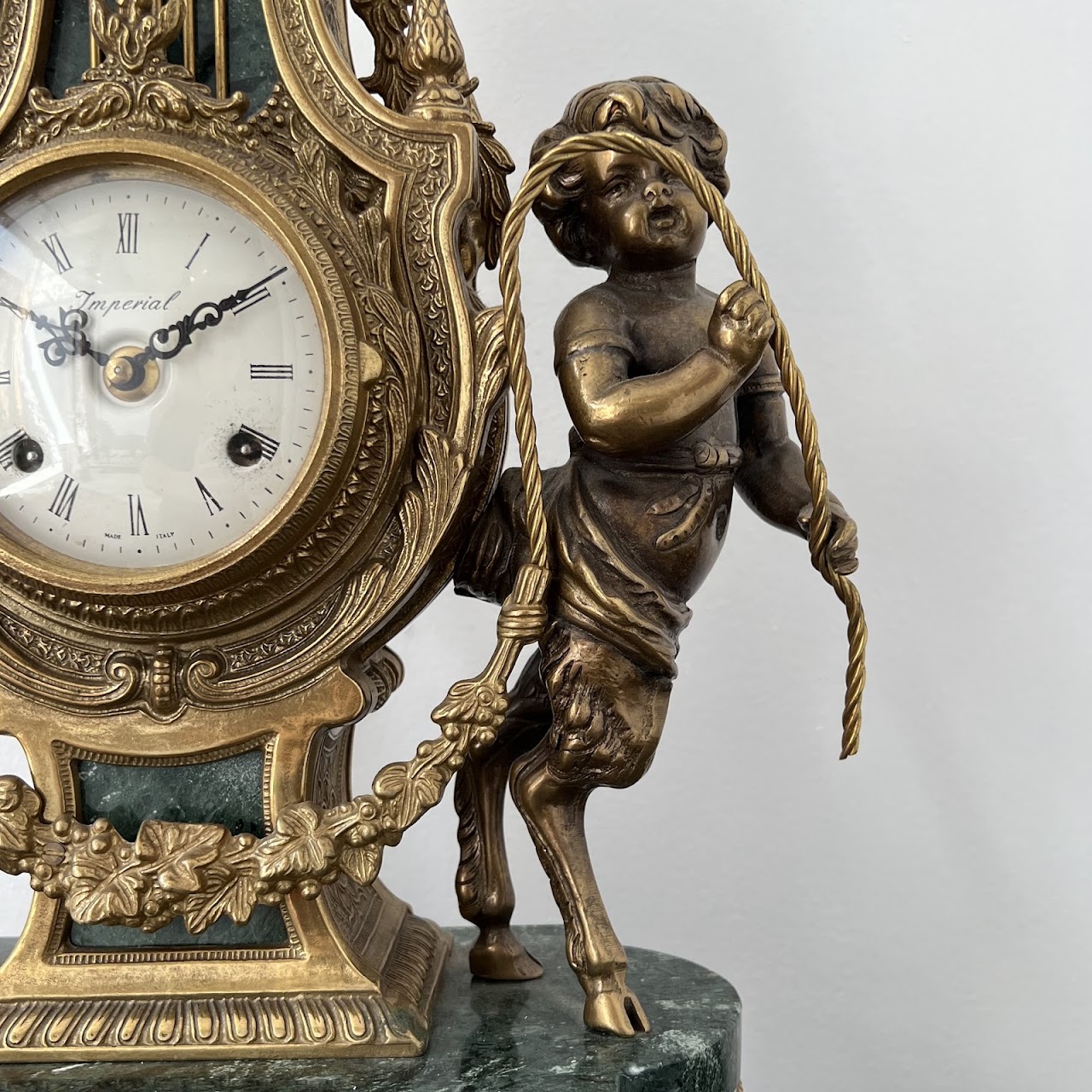 Brevettato Italian Antique Brass and Green Marble Figural Mantel Clock and Candelabra Pair