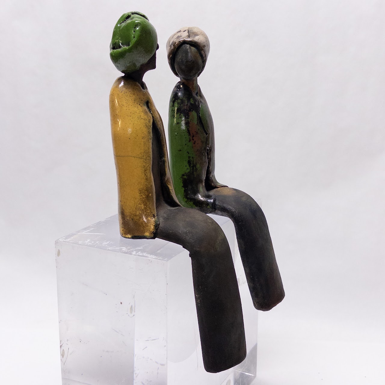 Signed Ceramic Pair of Table Edge Sitting Figurines