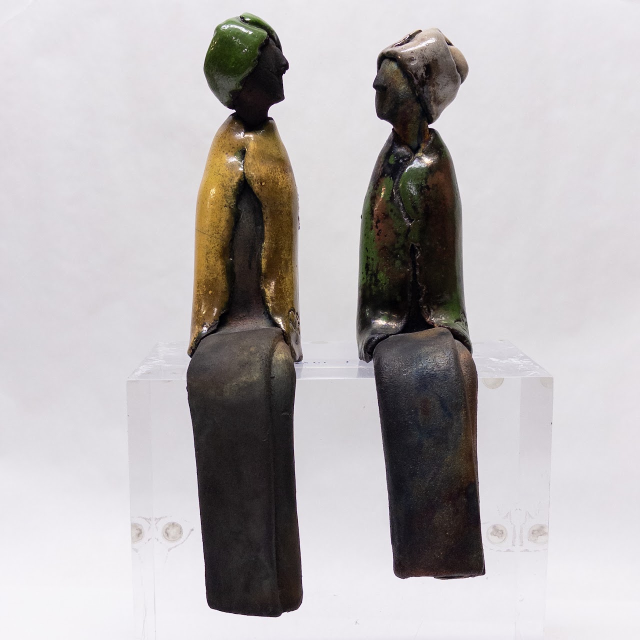 Signed Ceramic Pair of Table Edge Sitting Figurines