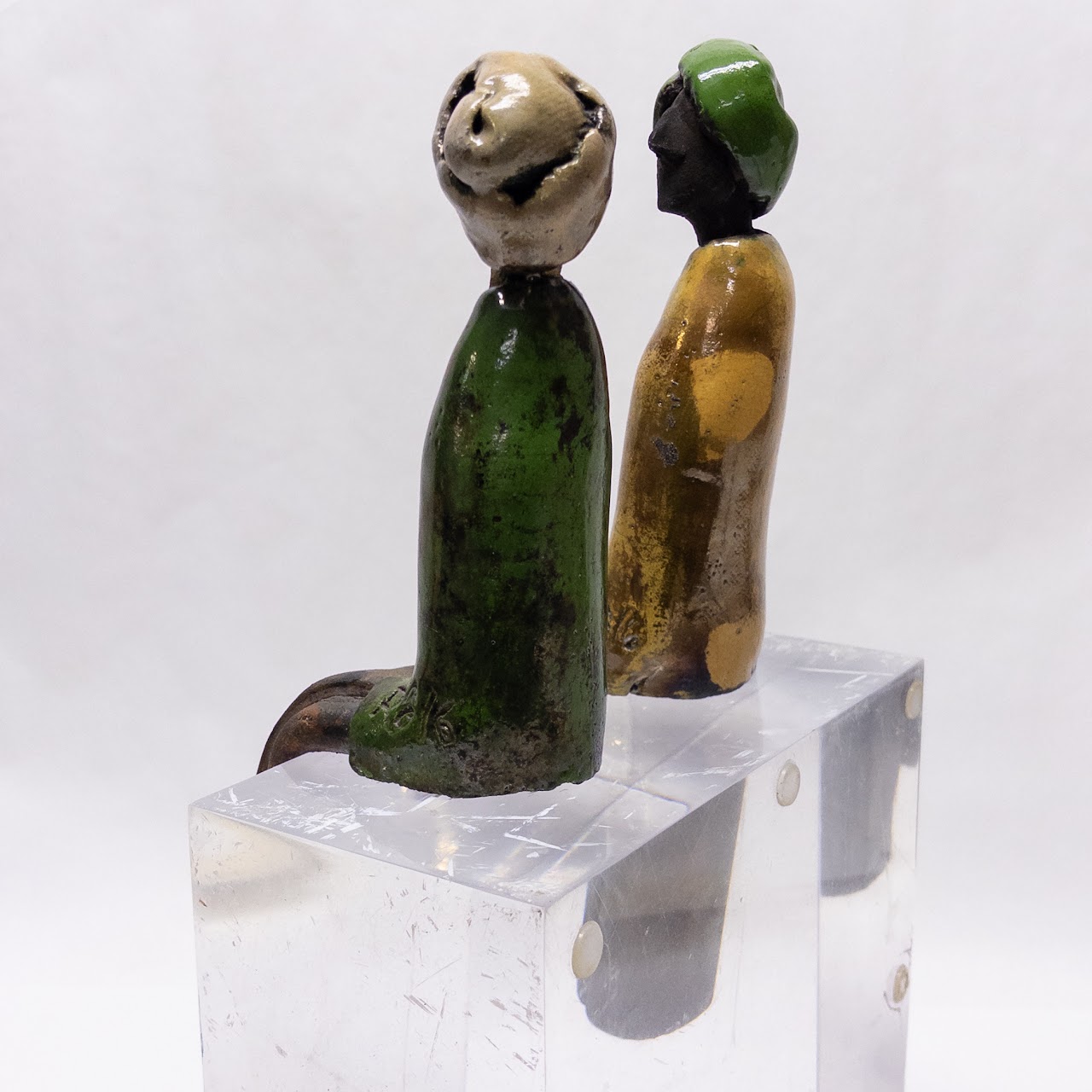 Signed Ceramic Pair of Table Edge Sitting Figurines