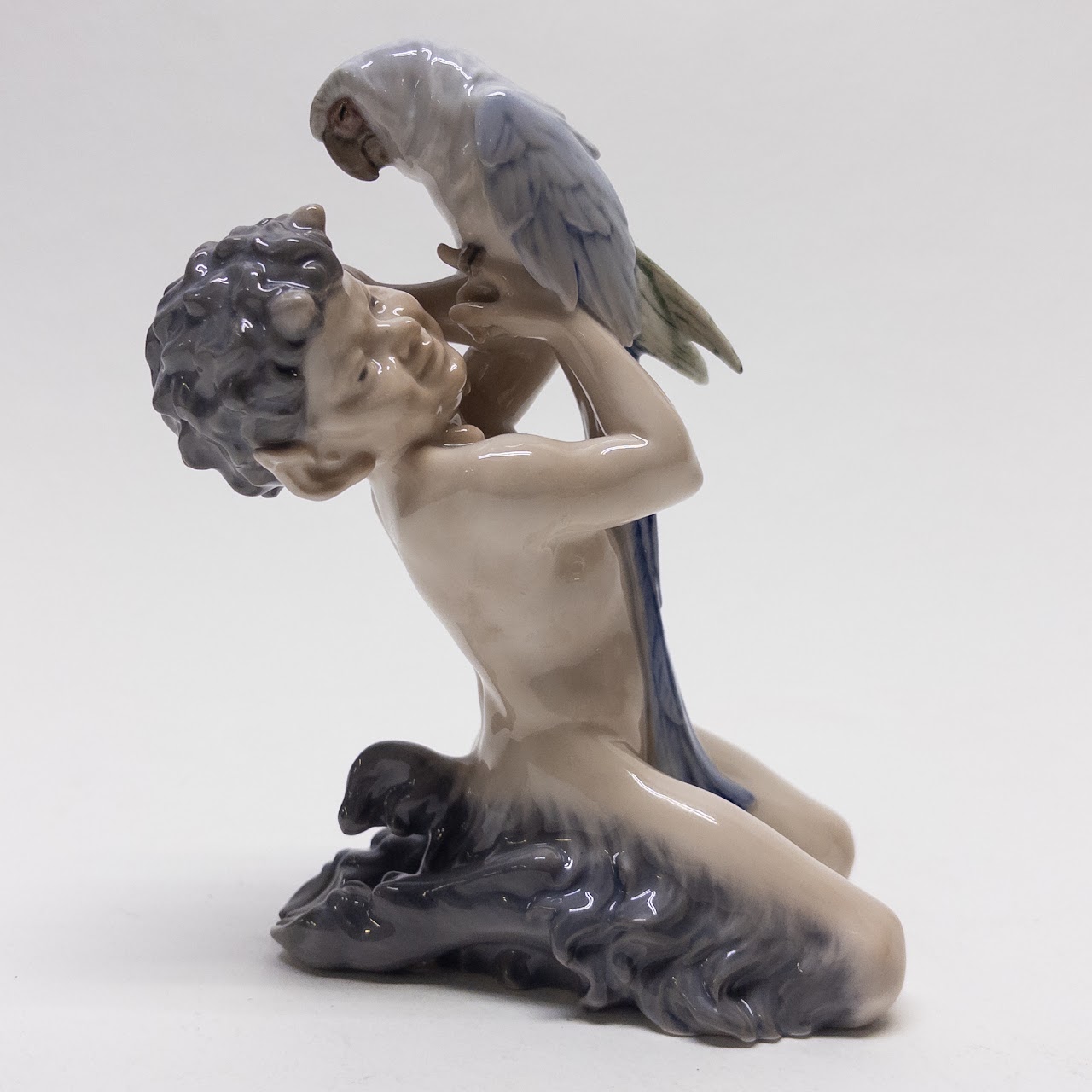 Royal Copenhagen Faun Holding a  Parrot Figurine