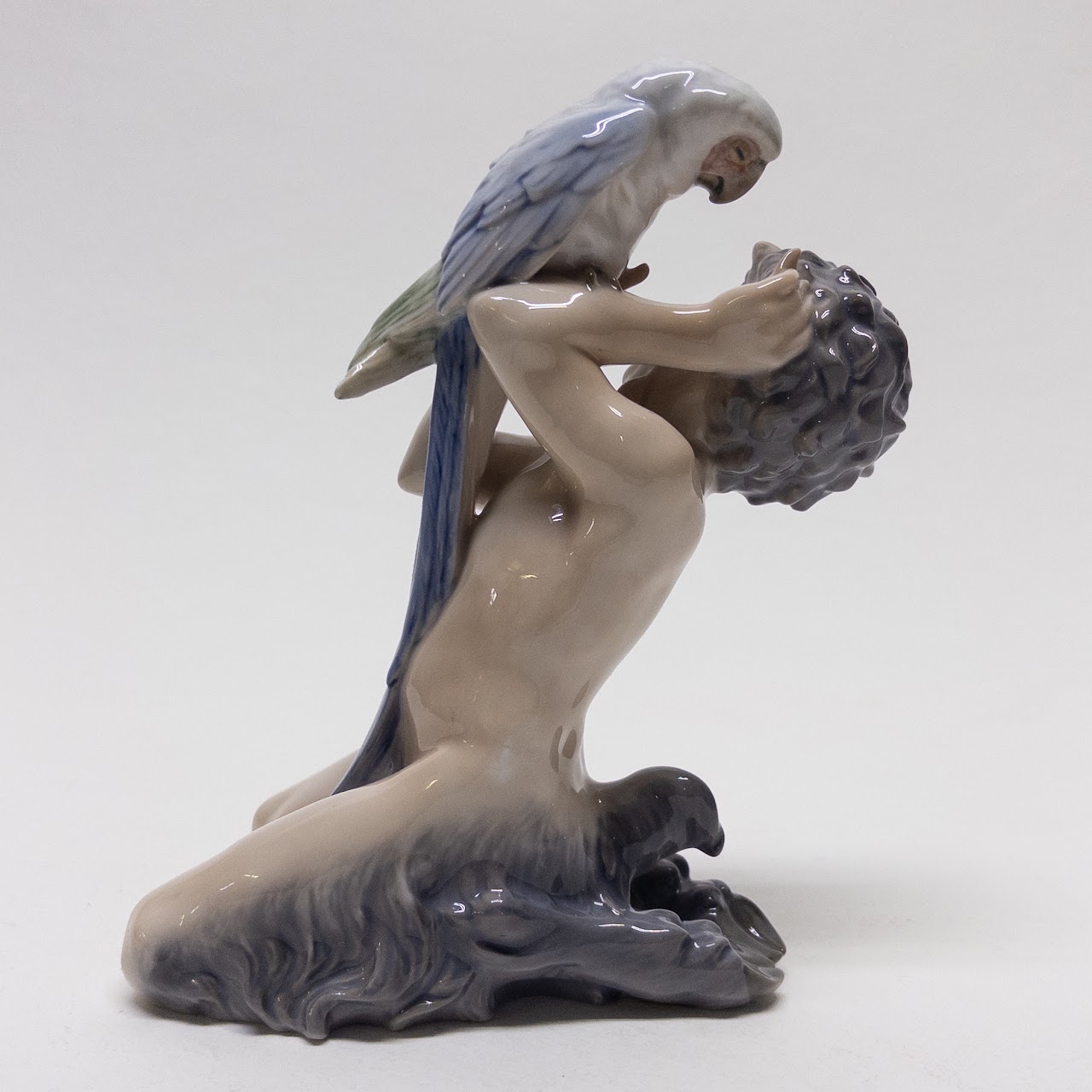 Royal Copenhagen Faun Holding a  Parrot Figurine