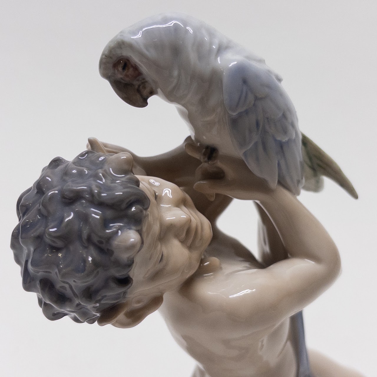 Royal Copenhagen Faun Holding a  Parrot Figurine