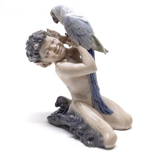 Royal Copenhagen Faun Holding a  Parrot Figurine