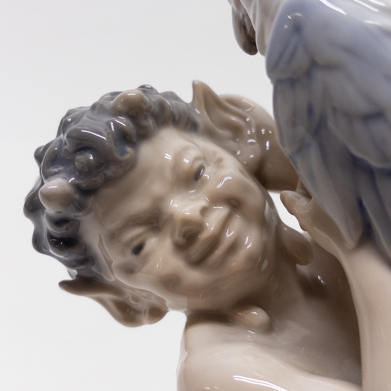 Royal Copenhagen Faun Holding a  Parrot Figurine