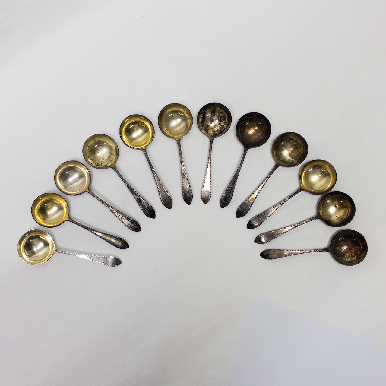 Twelve Sterling Silver Merklein Spoons