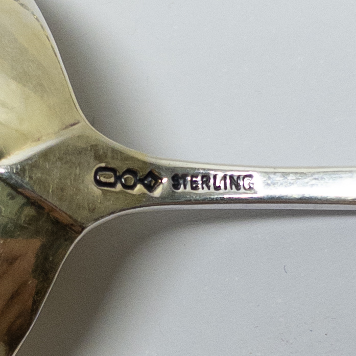 Twelve Sterling Silver Merklein Spoons