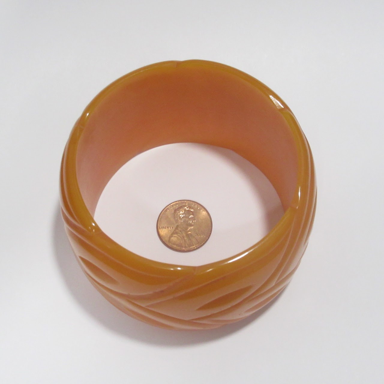 Orange Bakelite Carved Bangle