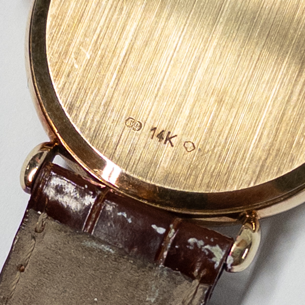 14K Gold Tourneau Date Window Watch