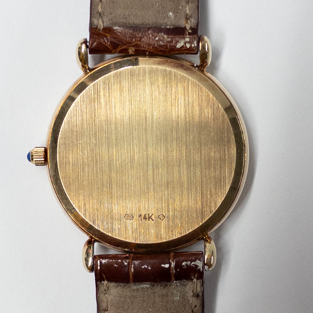 14K Gold Tourneau Date Window Watch