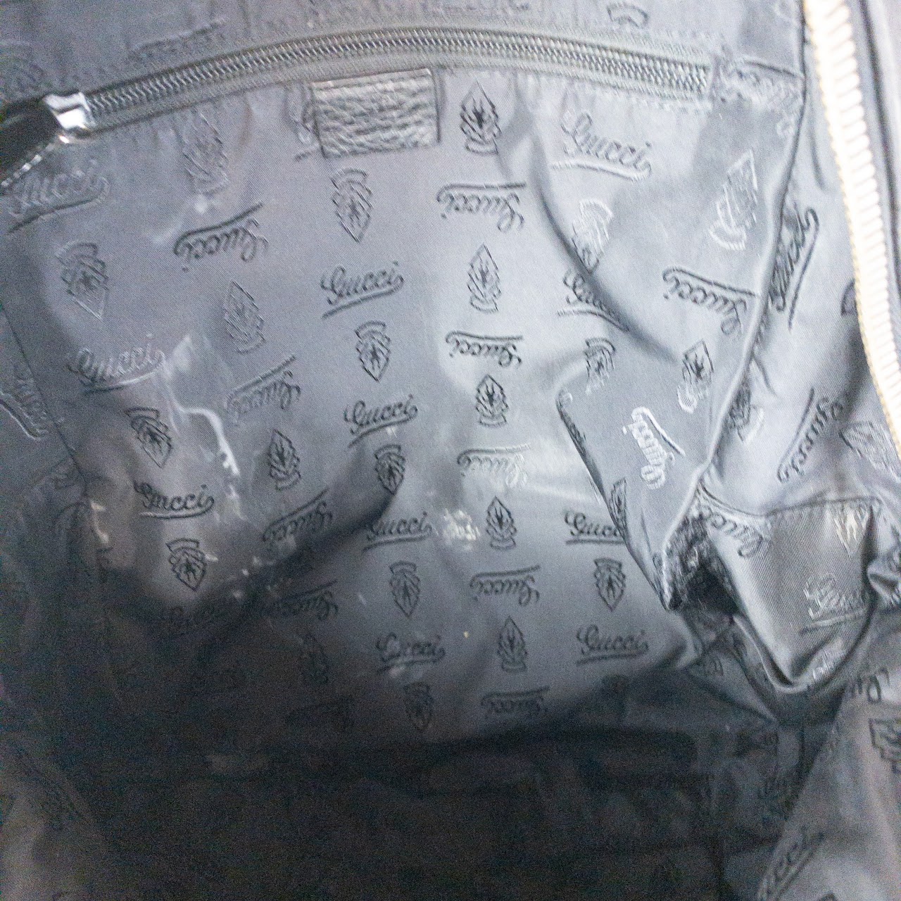 Gucci Monogram Leather Backpack