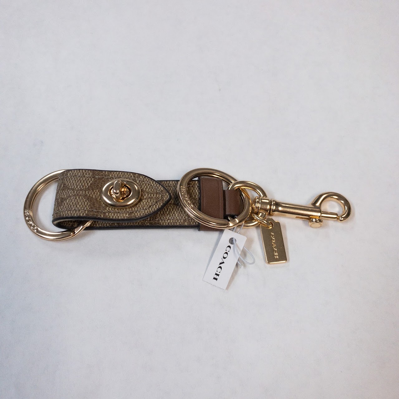 Coach New Turnlock Keychain