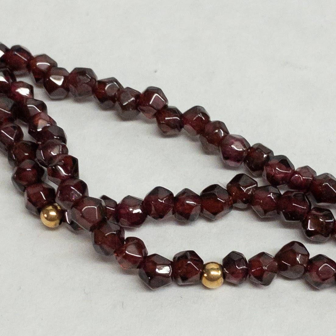 Garnet and 14K Gold Triple Strand Necklace