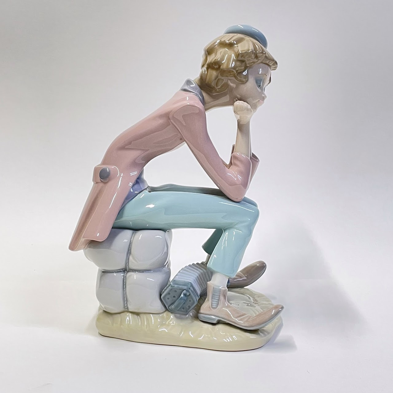 Lladró Pensive Sitting Clown with Accordion Figurine